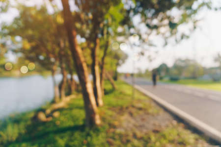 Blur public exercise park for people runnung, jogging and walking. Healthy living lifestyle background.の写真素材
