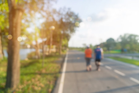 Blur public exercise park for people runnung, jogging and walking. Healthy living lifestyle background.の写真素材