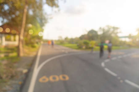 Blur public exercise park for people runnung, jogging and walking. Healthy living lifestyle background.の写真素材