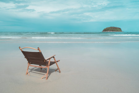 Tropical nature clean beach and white sand with chair in summer with sun light blue sky.