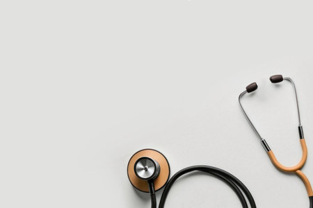 Top view of stethoscope on color  background with empty copy space, flat design. Health medical concept.の素材