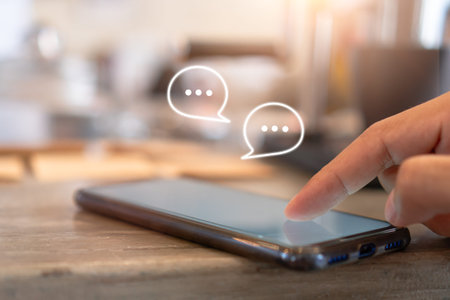 Young woman hand use smartphone  with chat and communication social media icons.