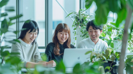 A company is having an open meeting employees in the conference room.の素材