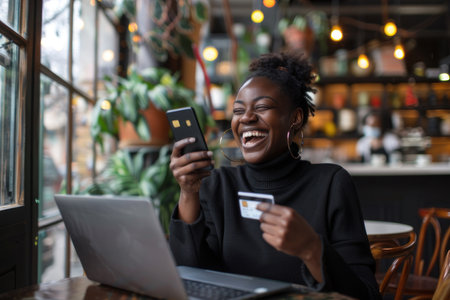 A happy black woman in her thirties having coffee with an African American man at the table.の素材