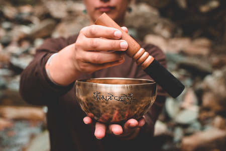 Singing bowl holed on the handの写真素材
