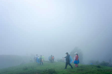 climbers at Jilongding mountain peak with dense fogのeditorial素材