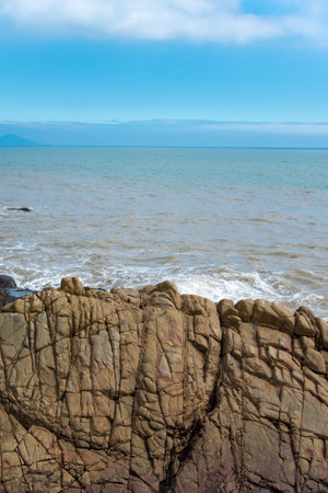 Washed stones by the seaの写真素材