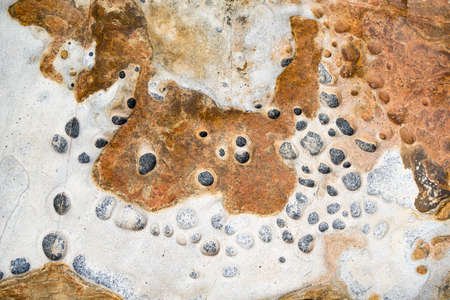 Close-up of eroded stones by the seaの写真素材