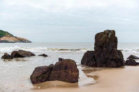The stones standing in the shallows by the seaの写真素材