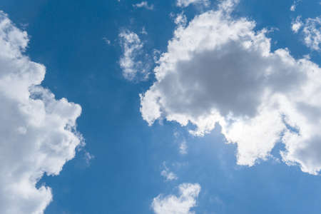 Blue sky and white clouds under direct sunlightの写真素材