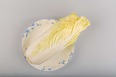 A yellow cabbage on a plateの写真素材