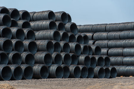 Steel materials stacked on the groundの写真素材