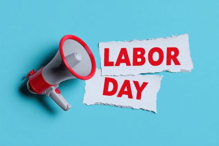 Red and gray megaphone announcing labor day on torn paper against a blue background eventの素材