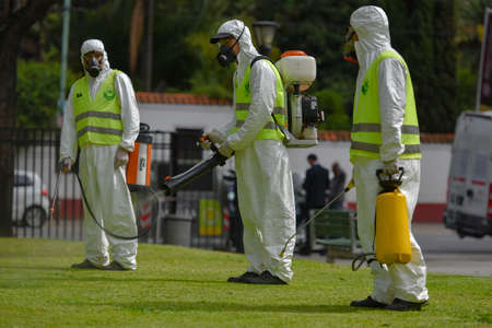 Buenos Aires, Argentina - March 3, 2016: Employees of the Ministry of Environment and Public Space fumigate for Aedes aegypti mosquitos to prevent the spread of zika virus and Dengue fever in park.のeditorial素材