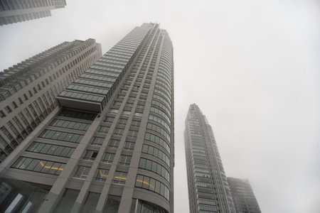 Buenos Aires, Argentina - Jun 28, 2016: Renoir Towers. Downtown skyscrapers under the fog upward...