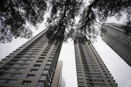 Buenos Aires, Argentina - Jun 28, 2016: Renoir Towers. Downtown skyscrapers under the fog upward view at the Puerto Madero.のeditorial素材