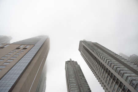 Buenos Aires, Argentina - Jun 28, 2016: Renoir Towers. Downtown skyscrapers under the fog upward view at the Puerto Madero.のeditorial素材