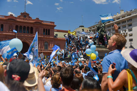 Buenos Aires, Argentina - Dec 10, 2015: Supporters of the newly elected Argentinean president wave flags on inauguration day at the Plaza de Mayo.のeditorial素材