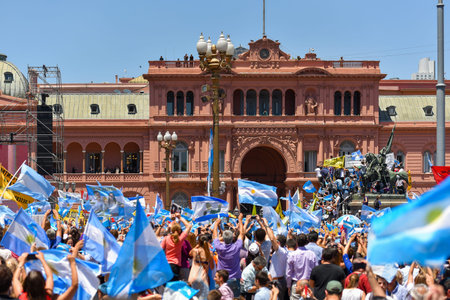 Buenos Aires, Argentina - Dec 10, 2015: Supporters of the newly elected Argentinean president wave...