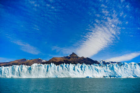 Los Glaciares National Park, Argentina - Mar 21, 2016: day view from the water at the Perito Moreno glacier in front of the mountain Cerro Moreno.の写真素材