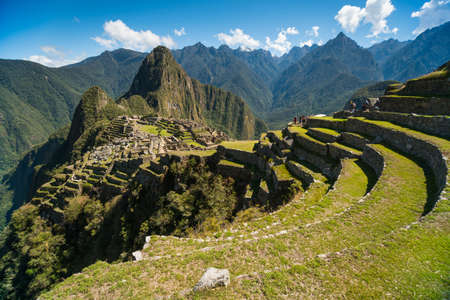 View of the Lost Incan City of Machu Picchu near Cusco, Peru. Machu Picchu is a Peruvian Historical Sanctuary. Terraces can be seen on foreground.の写真素材