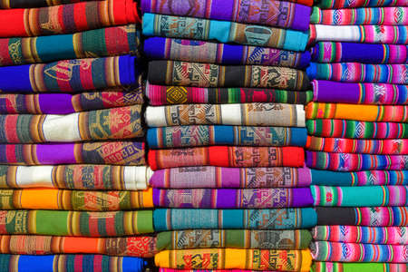 A pile of colorful rugged Peruvian textile and fabrics.の写真素材