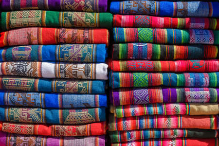 A pile of colorful rugged Peruvian textile and fabrics.の写真素材