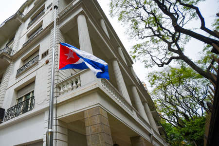 Buenos Aires, Argentina - Nov 26, 2016: Flag of Cuba at half-mast at the Embassy of Cuba in Buenos Aires, Argentina.のeditorial素材