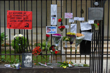 Buenos Aires, Argentina - Nov 26, 2016: Flowers and signs on a fence at the Embassy of Cuba in Buenos Aires, Argentina.のeditorial素材