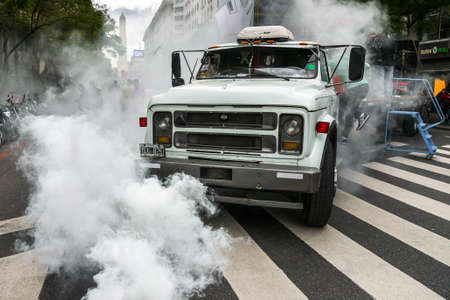 Buenos Aires, Argentina - 2 Sept, 2016: Truck in a smoke during protest of the worker unions against dismissals, tax rising and inflation.のeditorial素材