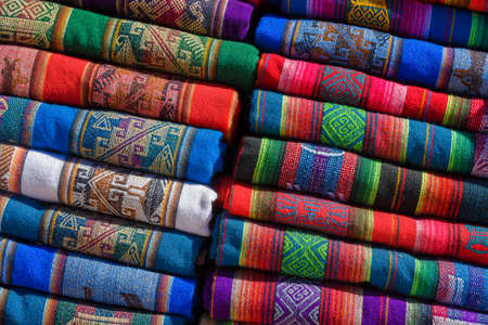 A pile of colorful rugged Peruvian textile and fabrics.の写真素材