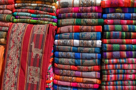 A pile of colorful rugged Peruvian textile and fabrics.の写真素材