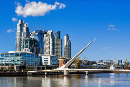 Daytime view at the waterfront in Puerto Madero with the Puente de la Mujer, Buenos Aires, Argentina.の写真素材