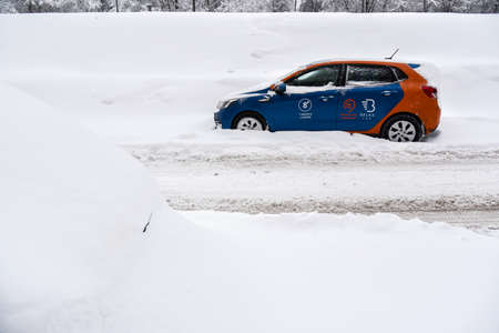 Moscow, Russia - 4 Feb, 2018: A Moscow carsharing service snow-covered car after a snowfall.のeditorial素材