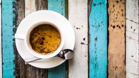 Coffee cup with beautiful nature and lighting on wood background.の写真素材