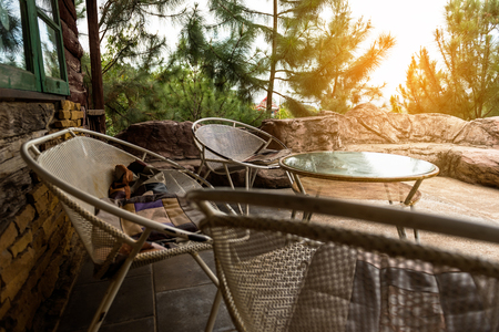 Resting corner with wooden chair and sunlightの写真素材