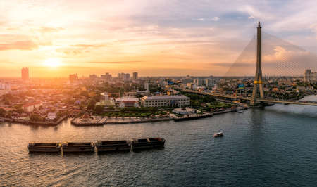 sunset bangkok chao phraya river and rama8 birdgeの写真素材