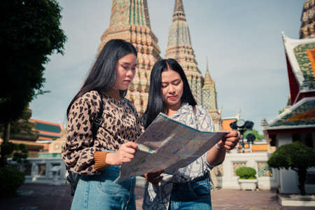 Young tourist traveling in Thai temple Bangkok, Thailandの写真素材