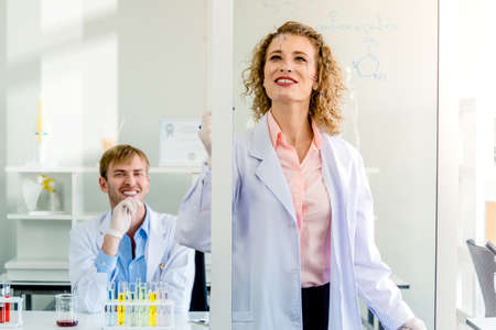 Scientists teamwork with senior brainstorming teaching and research laboratory in labの写真素材