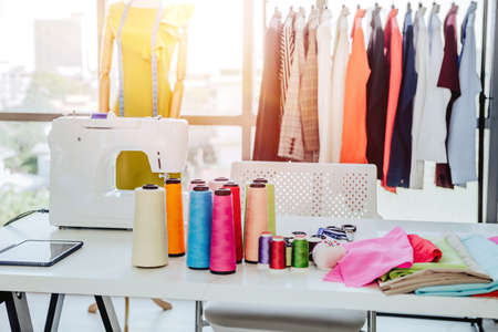 Creative Garment Design Tailoring Service Concept. Cute Professional Sewer Measuring Male Bearded Model Waist or Hip. Smiling Outfit Designer Taking Man Measurement for Formal Suit with Tape Meterの写真素材