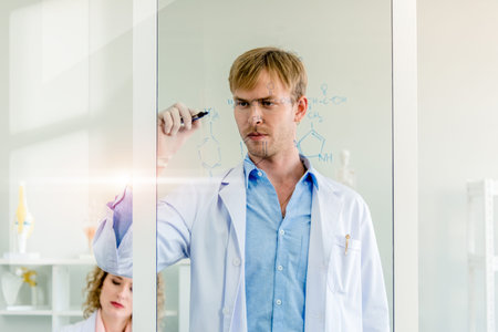 Scientists teamwork with senior brainstorming teaching and research laboratory in lab