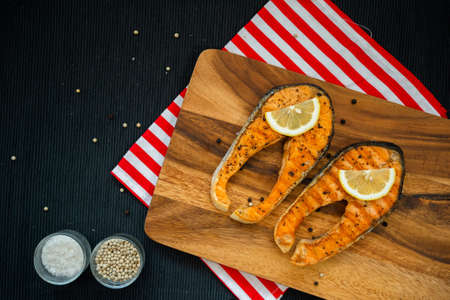 Cooked salmon steaks are prepared and served with Omega 3 Japanese food.の写真素材