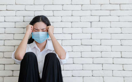 Unemployed woman, She is very sad and thinking because the corona outbreak of the Covid-19 virus is the cause of new normal around the world. Causing many unemployed. mental woman on white backgroundの写真素材