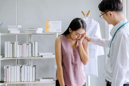 female mental concept. The young doctor's psychologist is talking with a mental patient woman at office の写真素材