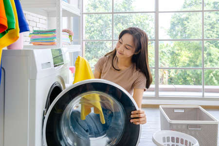 New maid Fighting with cleaning the house, washing clothes, mopping, sweeping the house, washing dishes, rearranging the room.の写真素材