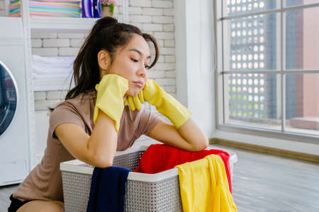 Women clean the house with clothes and liquid. To protect against viruses, Corona Covid-19 prevents the spread of the virus.の写真素材