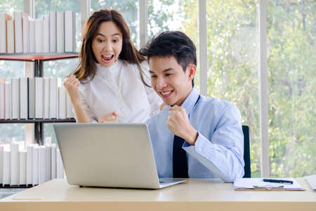 Concept corporate couple business people, handsome businessman Confident and employees Beautiful office woman Are present talking about a new financial company's project. professional teamwork.の写真素材