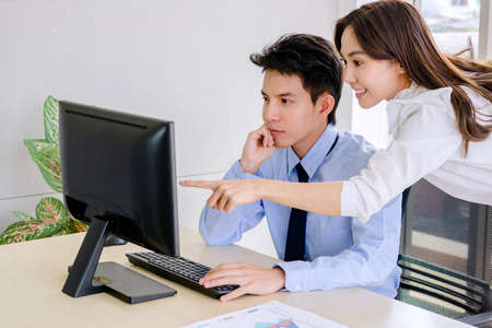 Concept corporate couple business people, handsome businessman Confident and employees Beautiful office woman Are present talking about a new financial company's project. professional teamwork.の写真素材