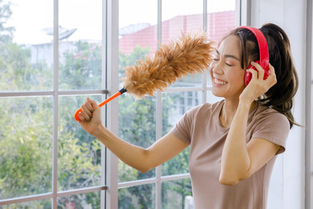 Women clean the house with clothes and liquid. To protect against viruses, Corona Covid-19 prevents...