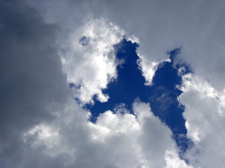 blue sky character with clouds